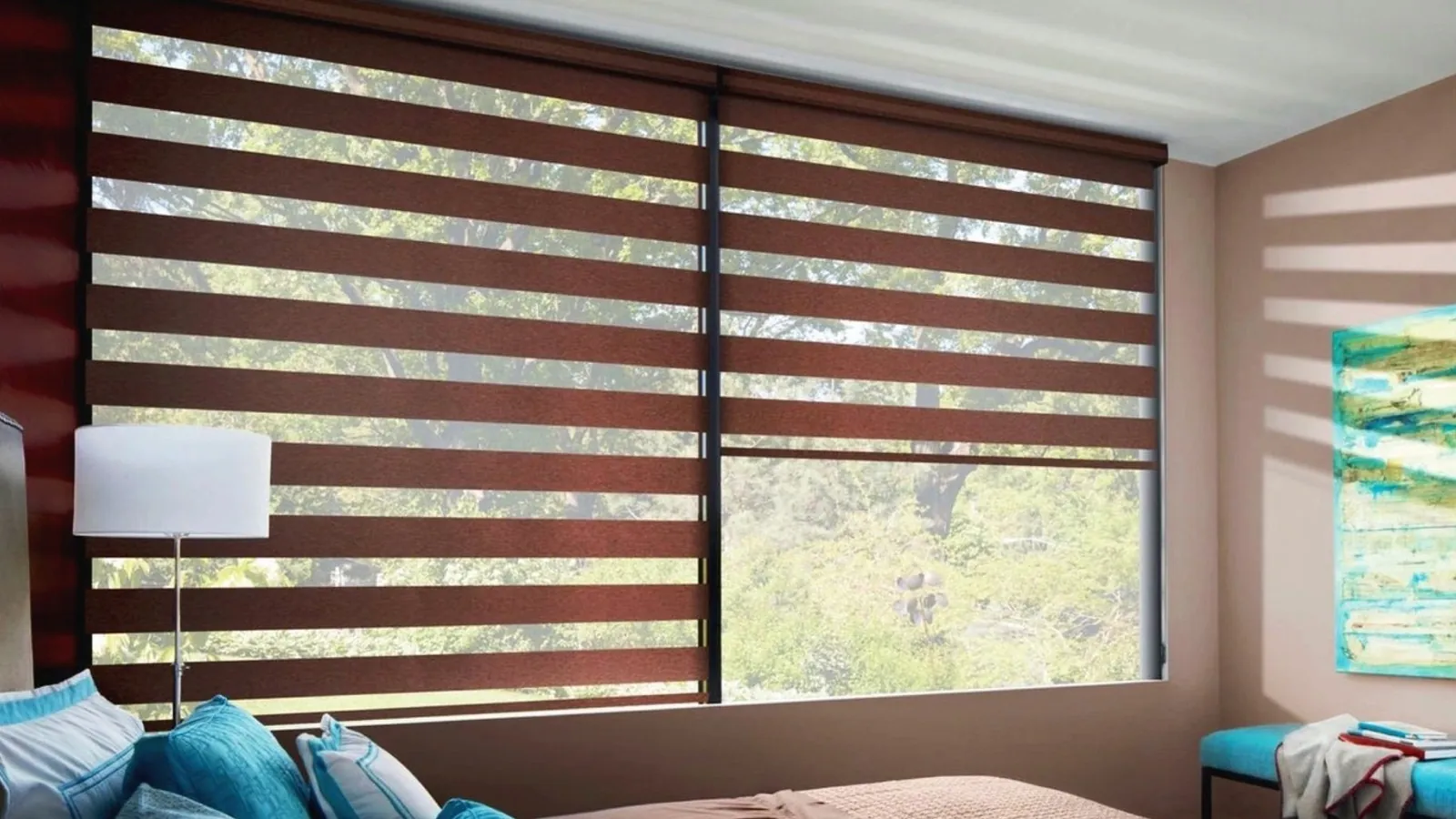 Banded dual roller shades filtering daylight over a wide living room window